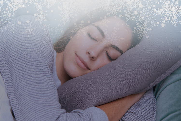 white woman sleeping with snow flakes