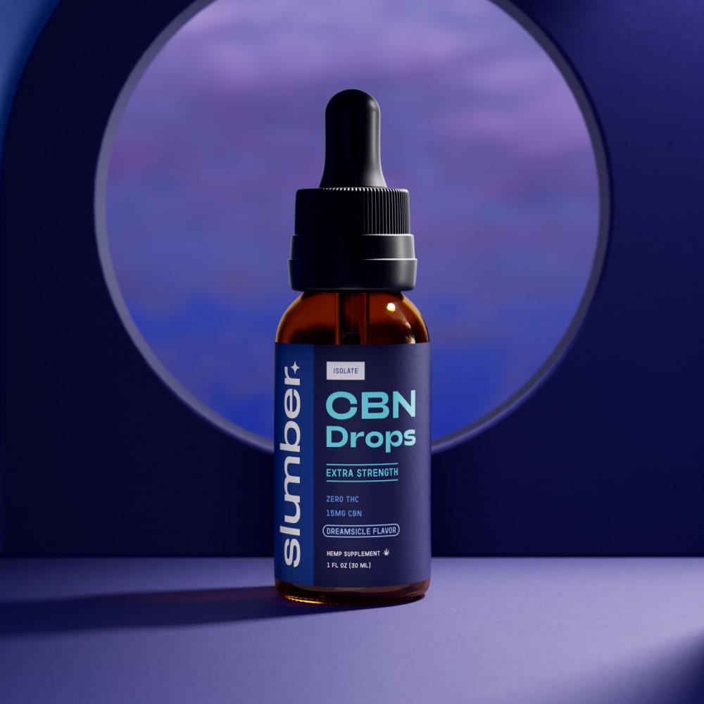 A bottle of 'Slumber Extra Strength CBN Drops' with 15mg of CBN per serving poised against a purple-toned background, suggesting a tranquil nighttime environment, suitable for promoting sleep.