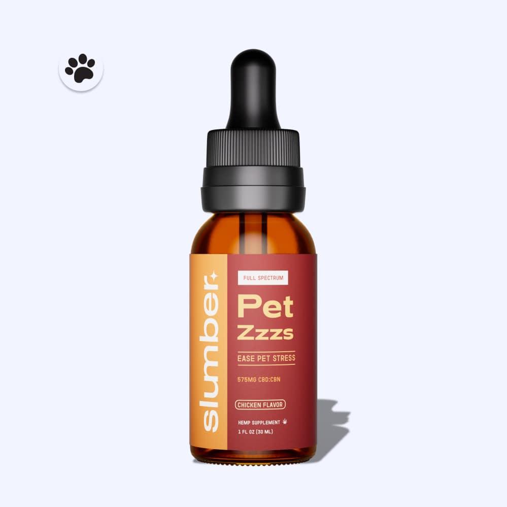 A dropper bottle of 'Slumber Pet Zzzs' full spectrum oil designed to ease pet stress, with 575mg of CBD and CBN, in chicken flavor, against a white background with a paw print icon.