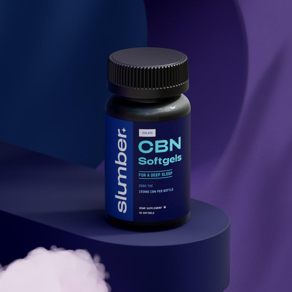 A bottle of 'Slumber CBN Softgels for Sleep' placed on a purple shelf with soft clouds in the background, offering 5mg of CBN per vegan capsule for enhanced sleep quality and relaxation with zero THC content.
