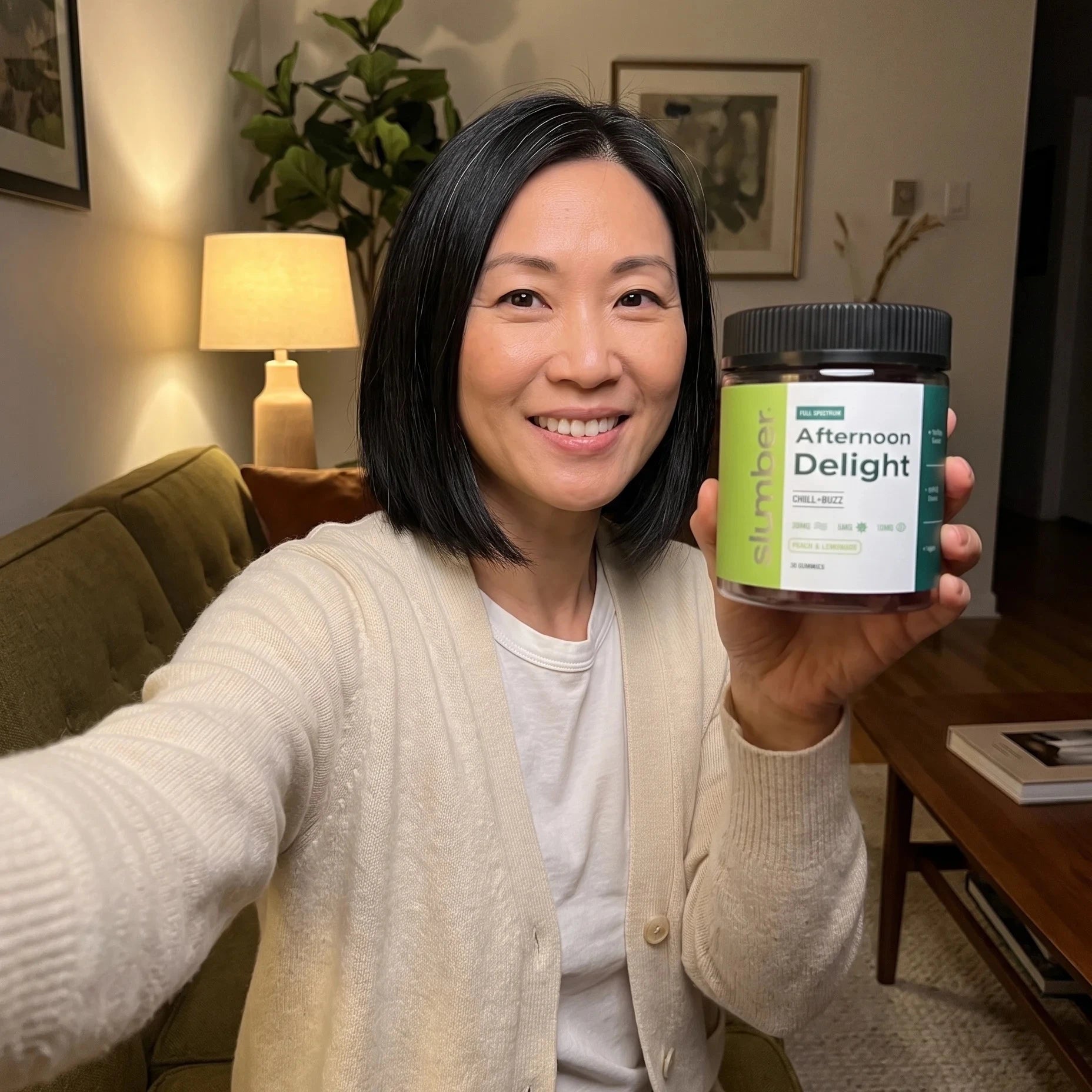 Woman holding a Slumber Afternoon Delight jar